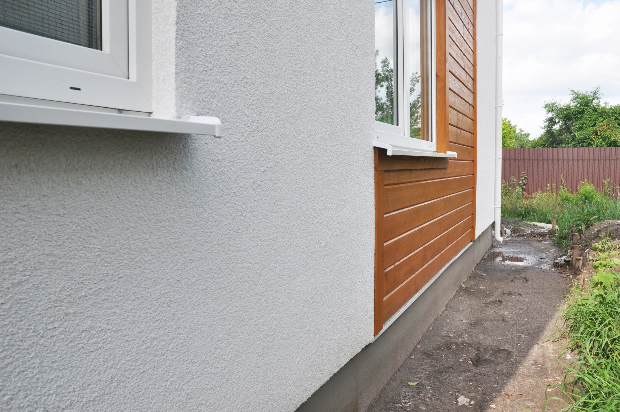 House with stucco and horizontal siding wall